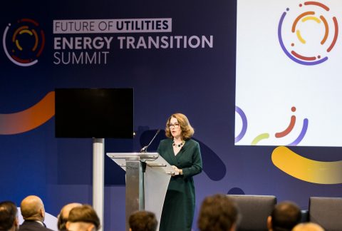 Sarah on stage at conference