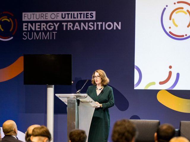 Sarah on stage at conference